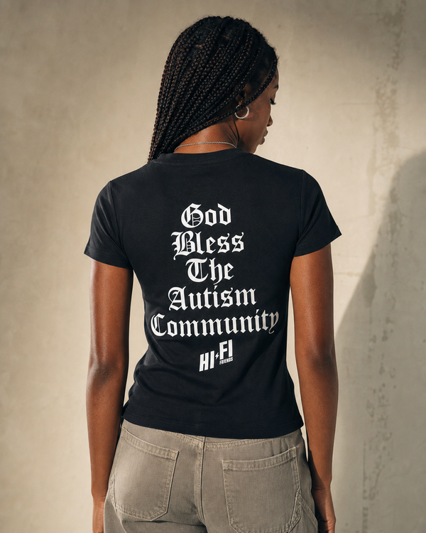 God Bless The Autism Community design on a women's essential tee.
