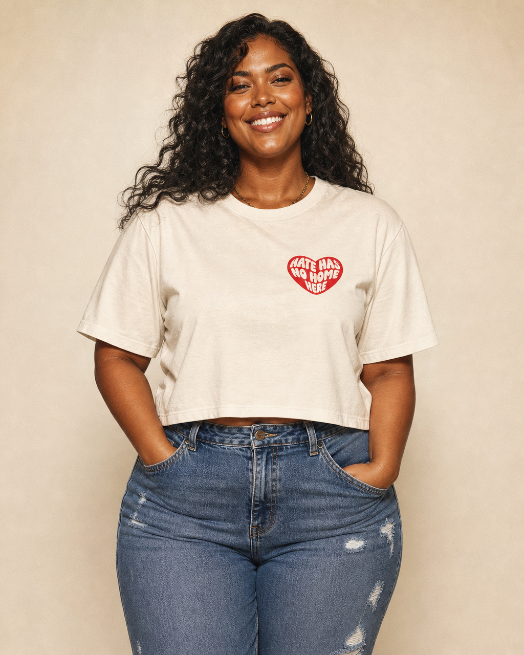 Hate Has No Home Here design on a women's seamless boxy tee.