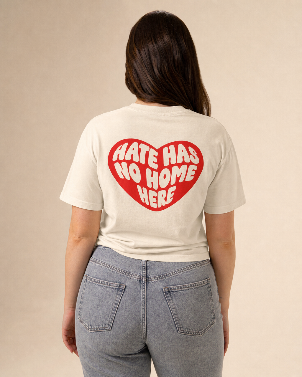 Hate Has No Home Here design on a women's seamless boxy tee.