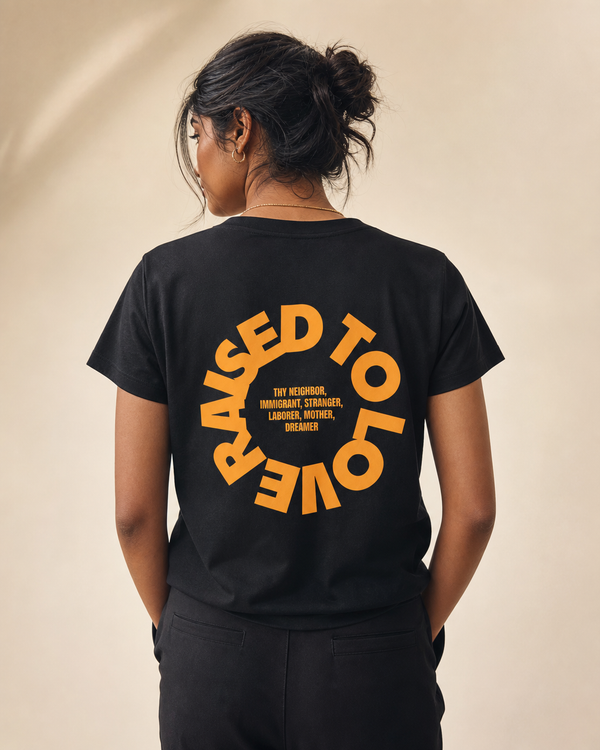 Raised To Love design on a women's essential tee.