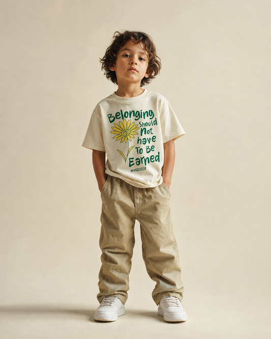 Belonging Should Not Have to Be Earned design on a heavyweight, sensory-friendly youth tee.