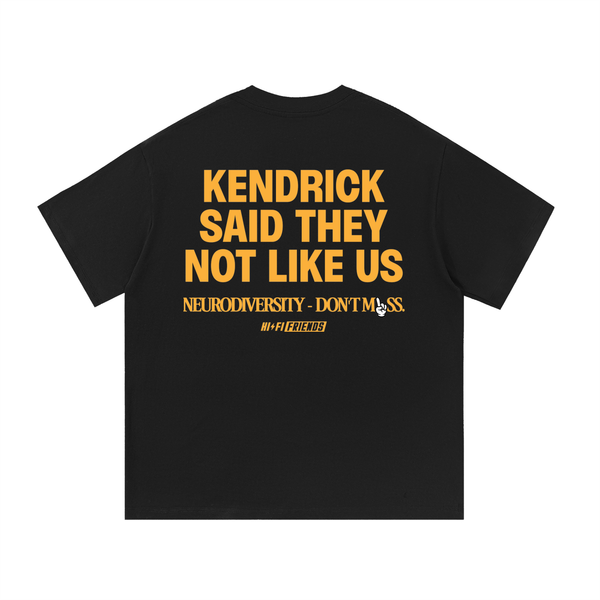 Not Like Us design on a unisex tee.