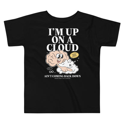 Toddler black t-shirt featuring a colorful illustration of a pink brain mascot riding on a white cloud mascot with "Up on a Cloud" styling.
